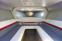 2013 Formula Thunderbird 353 FASTECH cabin interior with white and red seating.