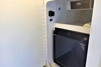 2013 Formula Thunderbird 353 FASTECH cabin with mini fridge and storage compartment.