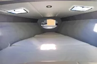 2013 Formula Thunderbird 353 FASTECH cabin interior with sleek design and comfortable bedding.