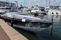 2013 Formula Thunderbird 353 FASTECH boat docked in a marina under a blue sky.