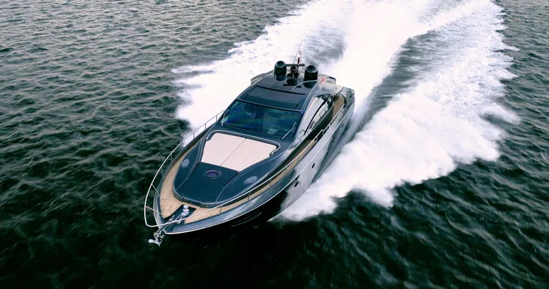  Yacht Photos Pics 2017 Pershing 70 yacht cruising swiftly on open water.