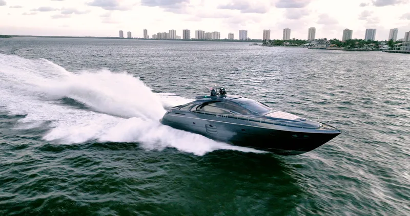  Yacht Photos Pics Luxurious 2017 Pershing 70 yacht cruising swiftly on open water.