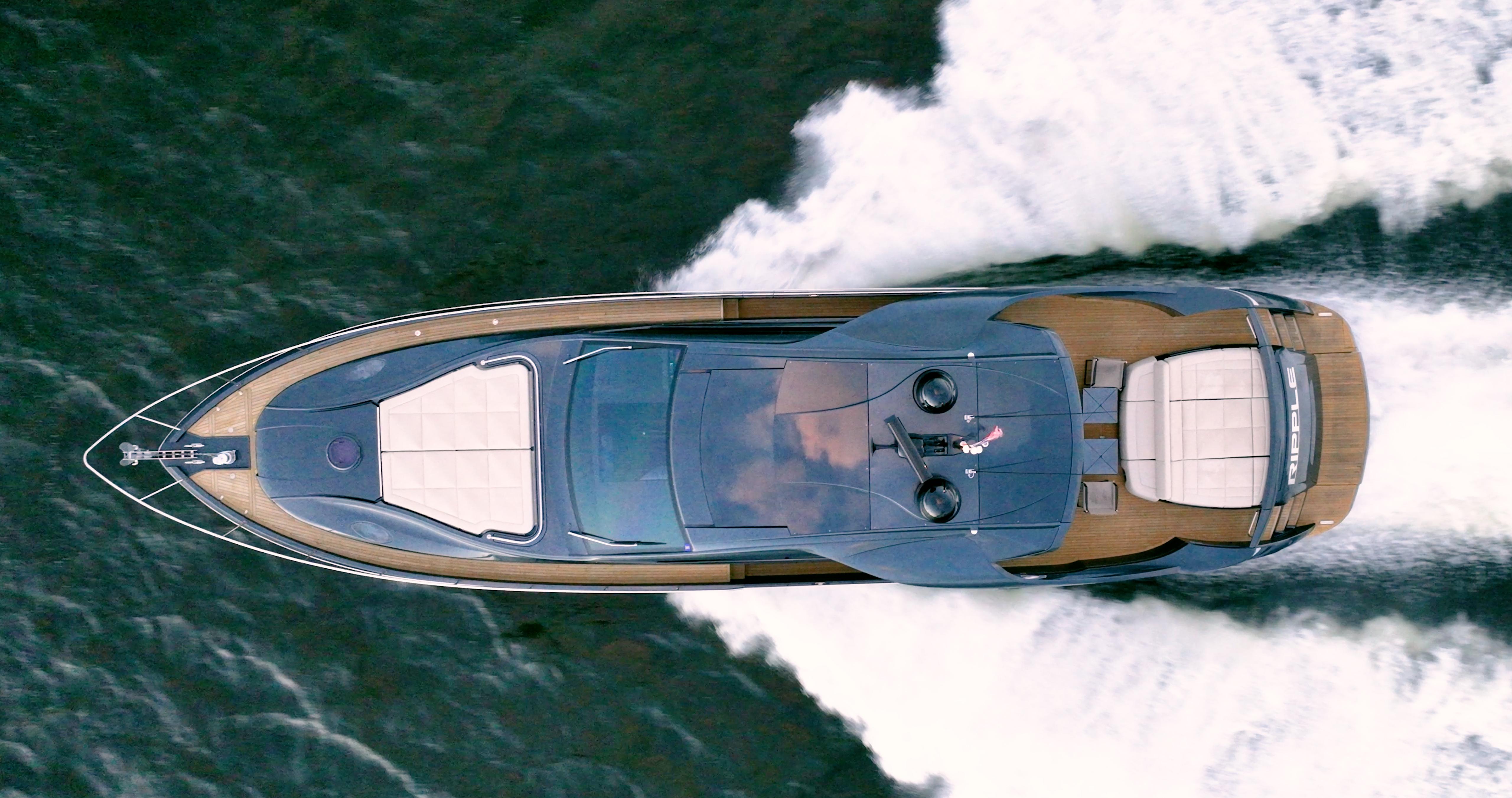 Aerial view of 2017 Pershing 70 yacht cruising on water.