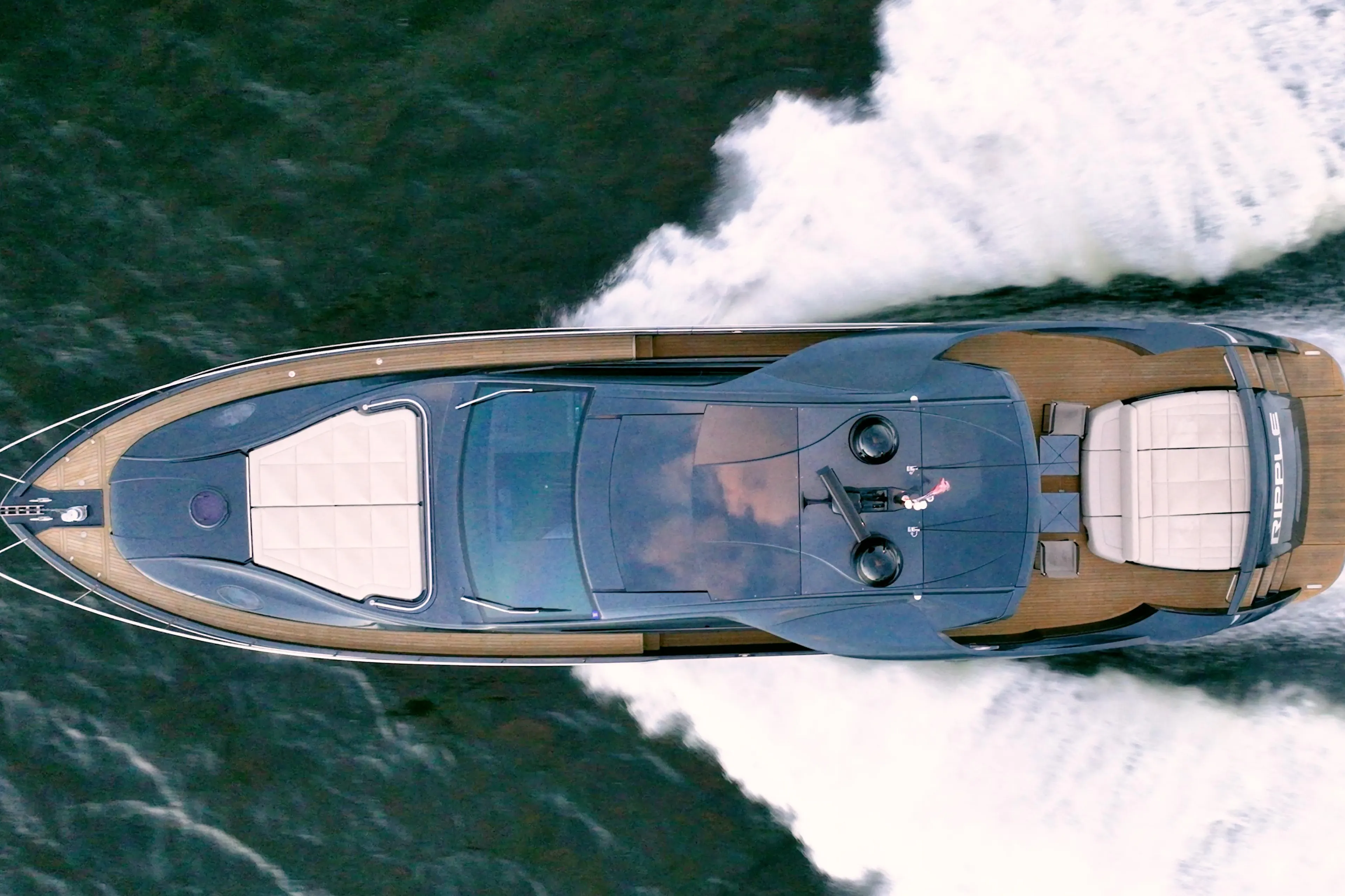 Aerial view of 2017 Pershing 70 yacht cruising on water.