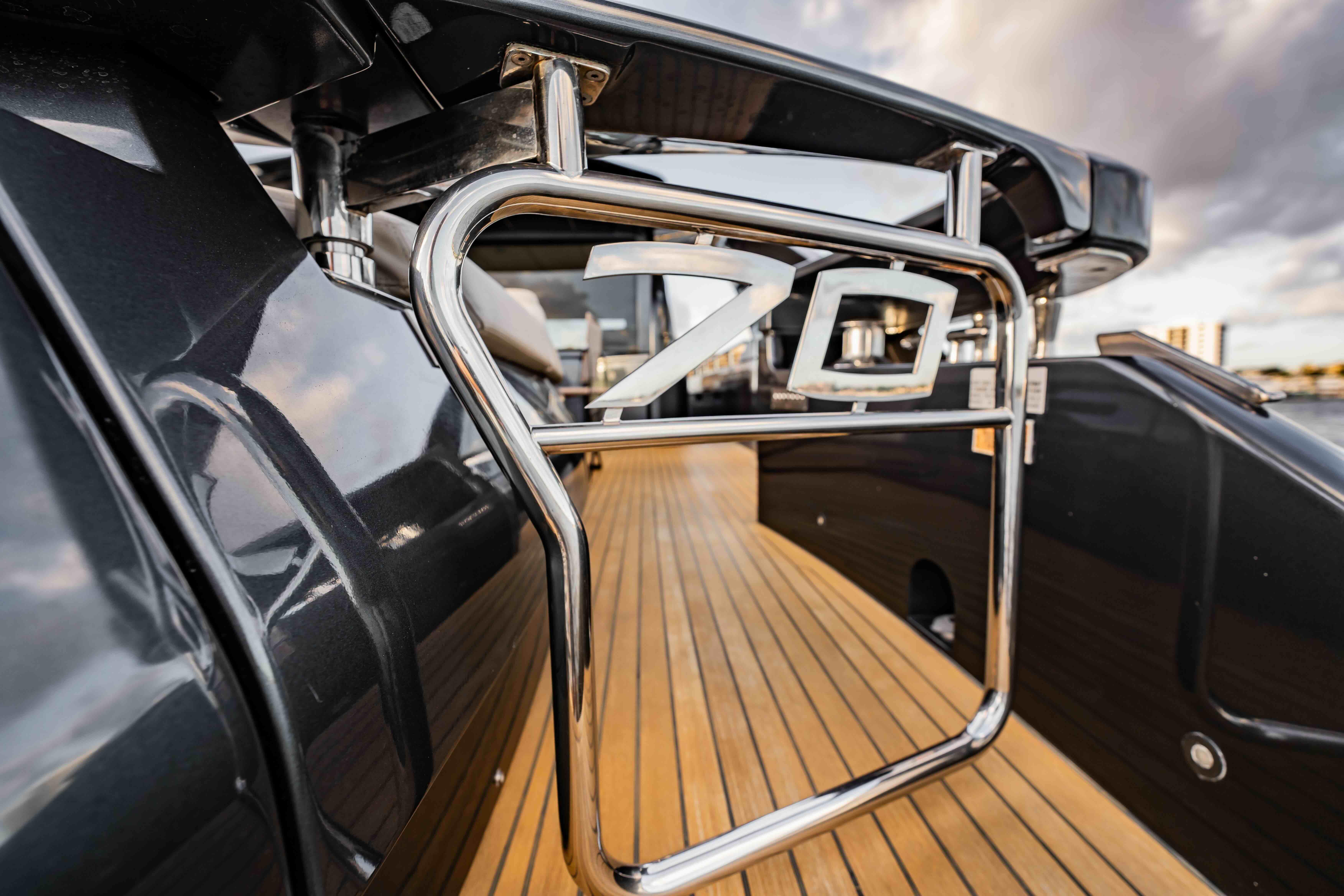 Luxurious 2017 Pershing 70 yacht with sleek design and wooden deck.