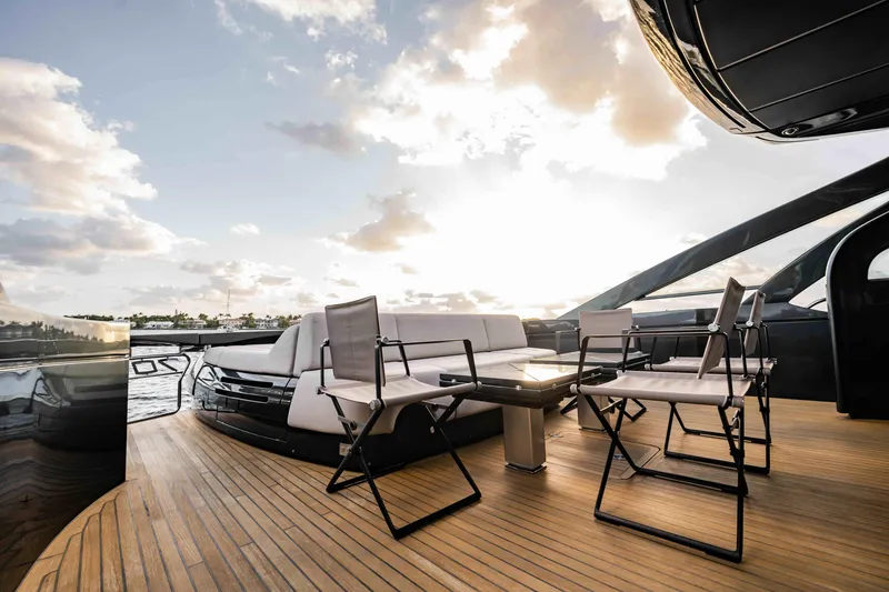  Yacht Photos Pics Luxurious 2017 Pershing 70 yacht deck with seating, sunset view, and elegant design.