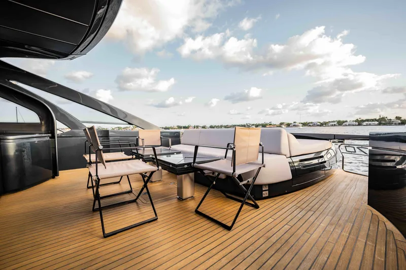  Yacht Photos Pics Luxurious deck of 2017 Pershing 70 yacht with modern seating and ocean view.