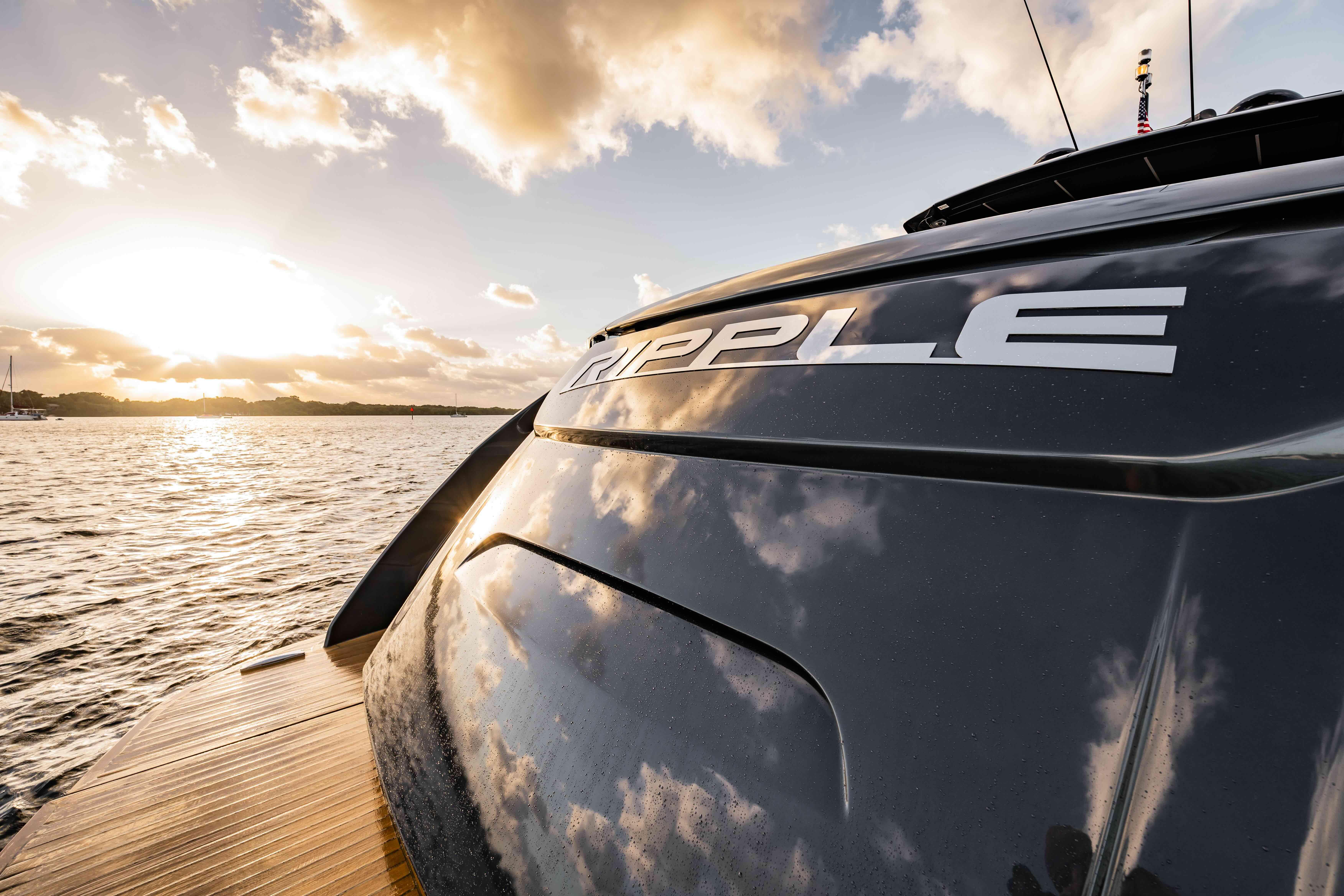 2017 Pershing 70 yacht "Ripple" at sunset on the water.