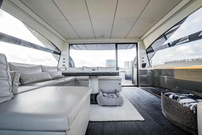  Yacht Photos Pics Luxurious interior of a 2017 Pershing 70 yacht with modern seating and panoramic windows.