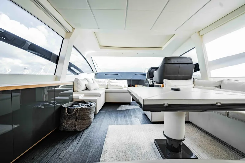  Yacht Photos Pics Luxurious interior of a 2017 Pershing 70 yacht with modern seating and sleek design.