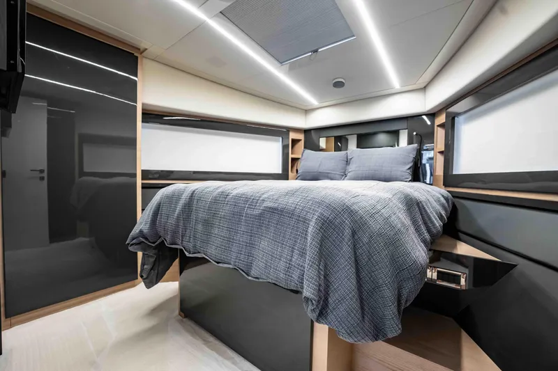  Yacht Photos Pics Luxurious bedroom interior of 2017 Pershing 70 yacht with modern design and cozy bedding.