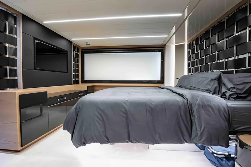  Yacht Photos Pics Luxurious bedroom interior of 2017 Pershing 70 yacht with modern design and sleek furnishings.