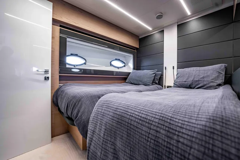  Yacht Photos Pics Luxurious twin bedroom in 2017 Pershing 70 yacht with modern design and cozy bedding.