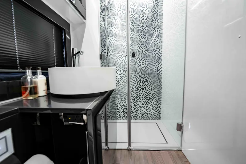  Yacht Photos Pics Luxurious bathroom in 2017 Pershing 70 yacht with modern sink and glass shower.