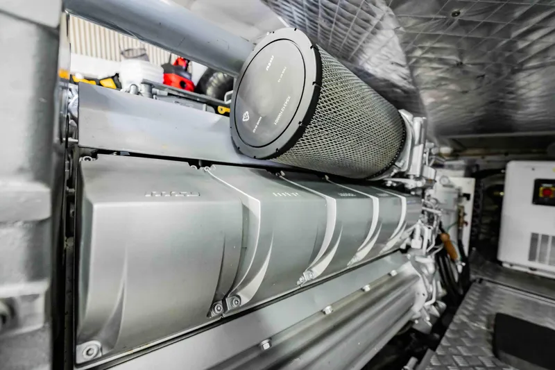  Yacht Photos Pics Engine room of a 2017 Pershing 70 yacht, showcasing advanced machinery.