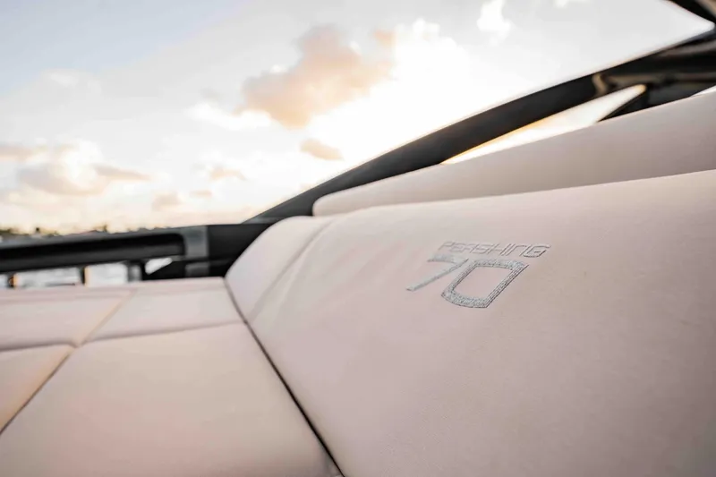  Yacht Photos Pics Luxurious seating on a 2017 Pershing 70 yacht with sunset backdrop.