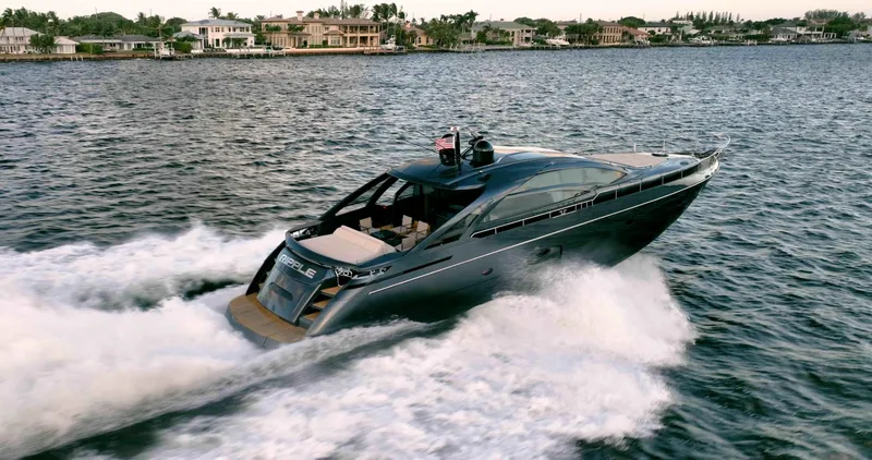  Yacht Photos Pics 2017 Pershing 70 yacht cruising on a scenic waterway near luxury homes.