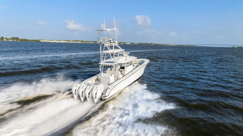  Yacht Photos Pics 2018 Yellowfin 42 Offshore boat cruising on open water, showcasing powerful engines.