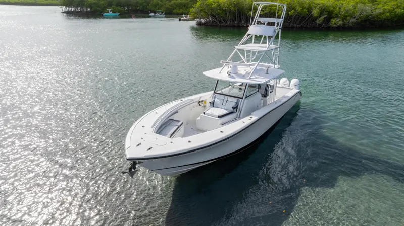  Yacht Photos Pics 2018 Yellowfin 42 Offshore boat on calm water near mangroves.