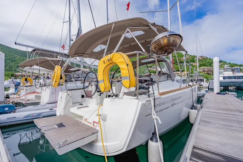 Minx Yacht Photos Pics 2024 Jeanneau Sun Odyssey 349 sailboat docked at marina, featuring modern design and equipment.