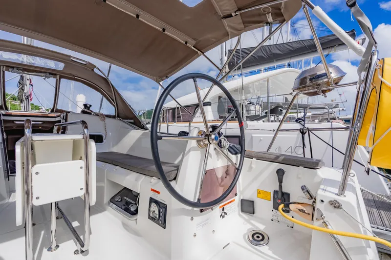 Minx Yacht Photos Pics 2024 Jeanneau Sun Odyssey 349 sailboat cockpit with steering wheel and canopy.