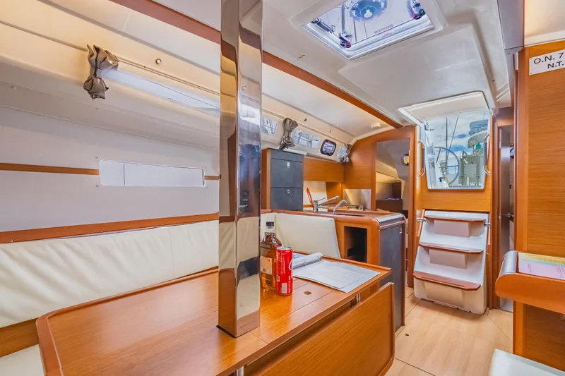 Minx Yacht Photos Pics 2024 Jeanneau Sun Odyssey 349 interior with modern kitchen and seating area.