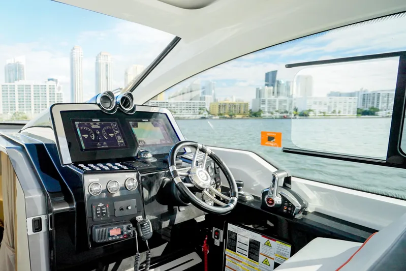  Yacht Photos Pics Interior of 2026 Granfort 370 GTX yacht with modern dashboard and city skyline view.