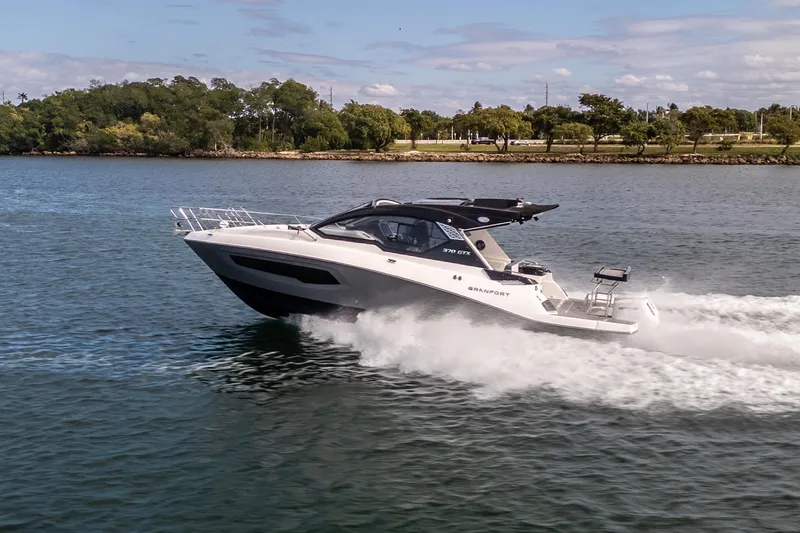  Yacht Photos Pics 2026 Granfort 370 GTX luxury yacht cruising on a scenic waterway.
