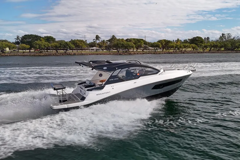  Yacht Photos Pics Luxury Granfort 370 GTX 2026 yacht cruising on a scenic waterway.