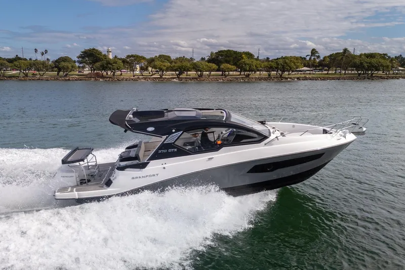  Yacht Photos Pics 2026 Granfort 370 GTX luxury yacht cruising on a scenic waterway.