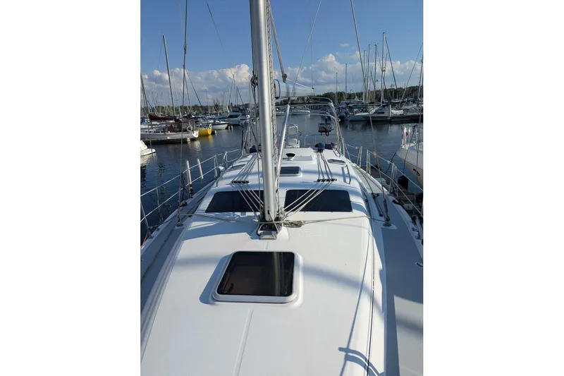 Dolce Vita Yacht Photos Pics 2004 Hunter 41 AC sailboat docked at marina, clear sky, calm waters.