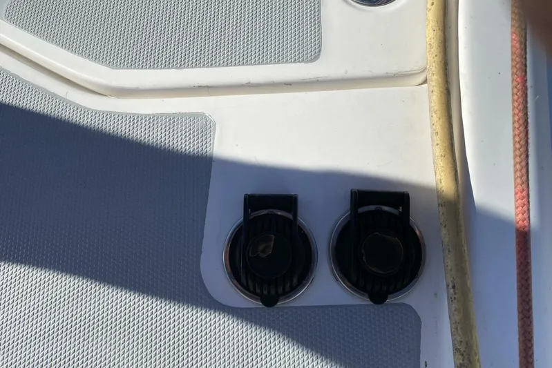 Dolce Vita Yacht Photos Pics Deck fittings on a 2004 Hunter 41 AC sailboat, featuring textured surfaces and utility hoses.