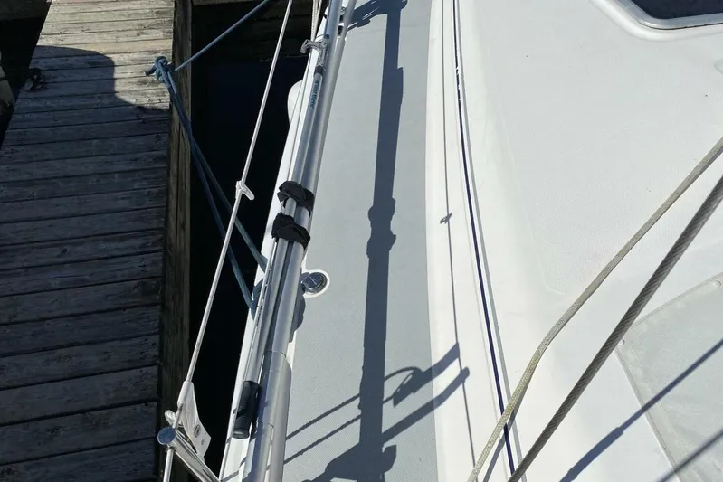 Dolce Vita Yacht Photos Pics 2004 Hunter 41 AC sailboat deck near wooden dock.