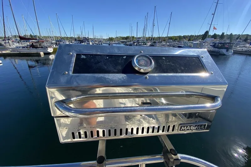 Dolce Vita Yacht Photos Pics Stainless steel Magma grill on a 2004 Hunter 41 AC sailboat, docked at a marina.