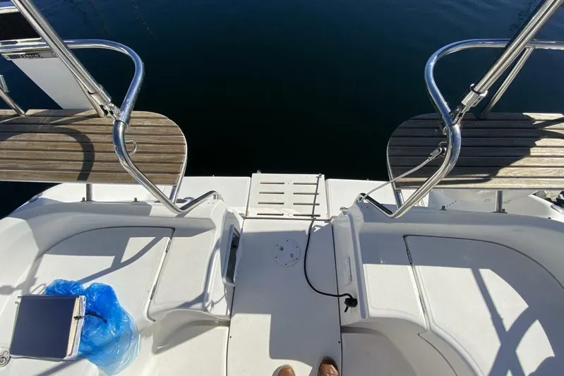 Dolce Vita Yacht Photos Pics Cockpit view of 2004 Hunter 41 AC sailboat with wooden steps and railing.