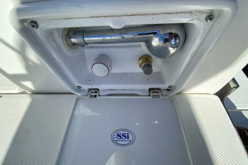 Dolce Vita Yacht Photos Pics Outdoor shower compartment on a 2004 Hunter 41 AC sailboat, featuring SSi logo.