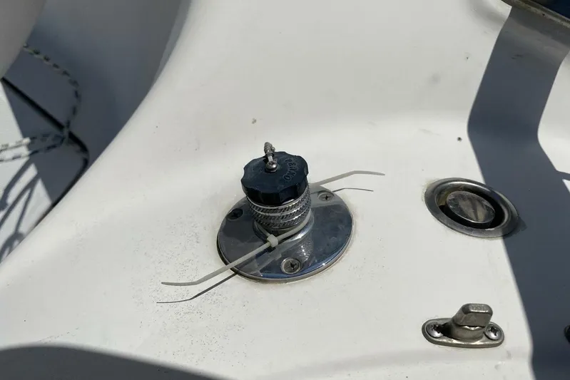 Dolce Vita Yacht Photos Pics Close-up of a 2004 Hunter 41 AC boat deck fitting with zip ties.