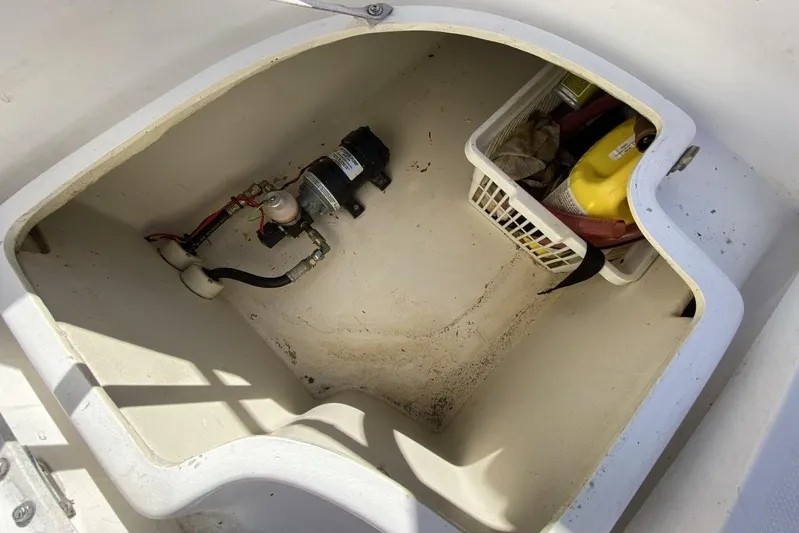 Dolce Vita Yacht Photos Pics Storage compartment of 2004 Hunter 41 AC boat with pump and supplies.