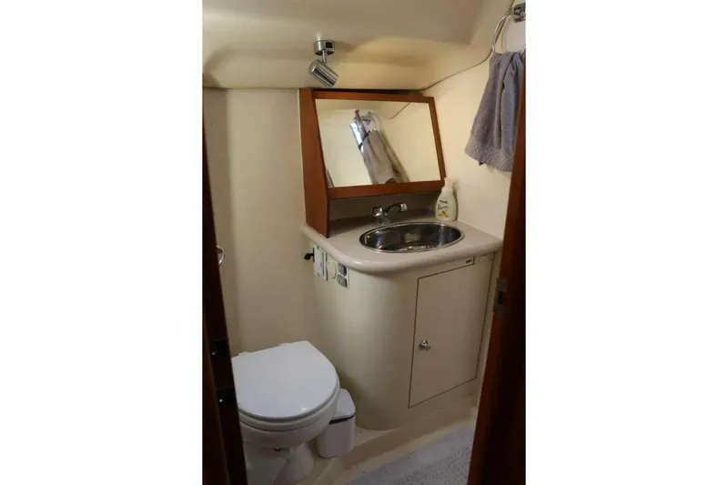 Dolce Vita Yacht Photos Pics Bathroom interior of 2004 Hunter 41 AC yacht with sink and toilet.