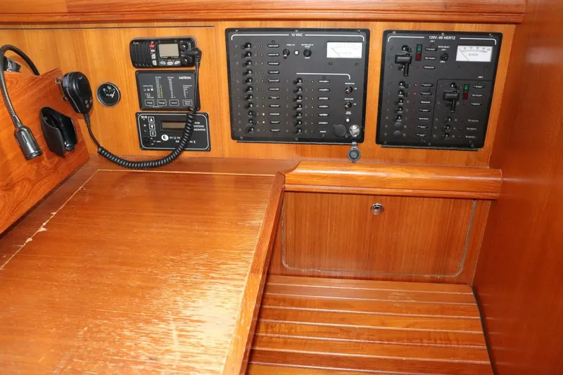 Dolce Vita Yacht Photos Pics Control panel of a 2004 Hunter 41 AC sailboat with communication equipment.