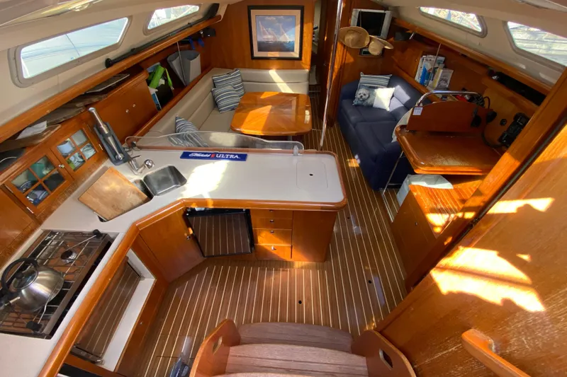 Dolce Vita Yacht Photos Pics Interior of 2004 Hunter 41 AC sailboat with wood finish and modern amenities.