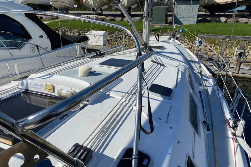 Dolce Vita Yacht Photos Pics Sailboat deck view of 2004 Hunter 41 AC, docked with visible rigging and equipment.