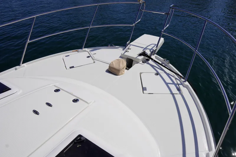 E Ticket Yacht Photos Pics Bow of 2015 Cutwater 30 Command Bridge boat with stainless steel railings.