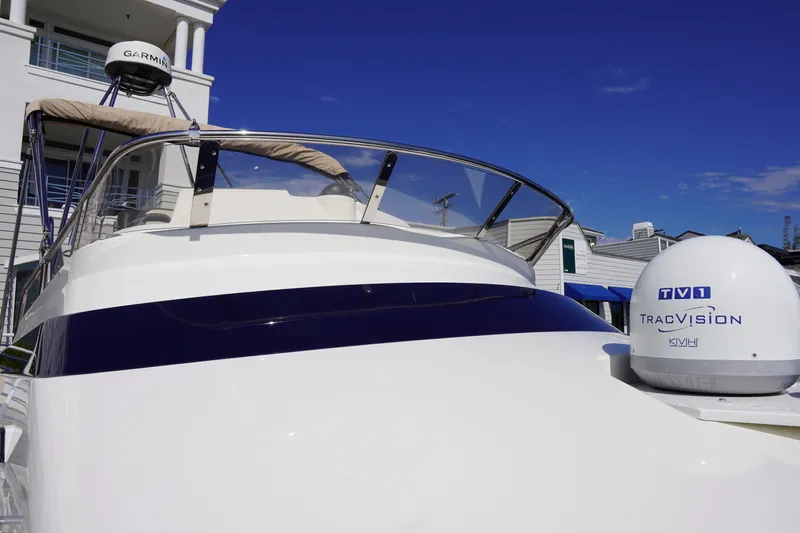 E Ticket Yacht Photos Pics 2015 Cutwater 30 Command Bridge boat with Garmin and TracVision equipment, under clear blue sky.