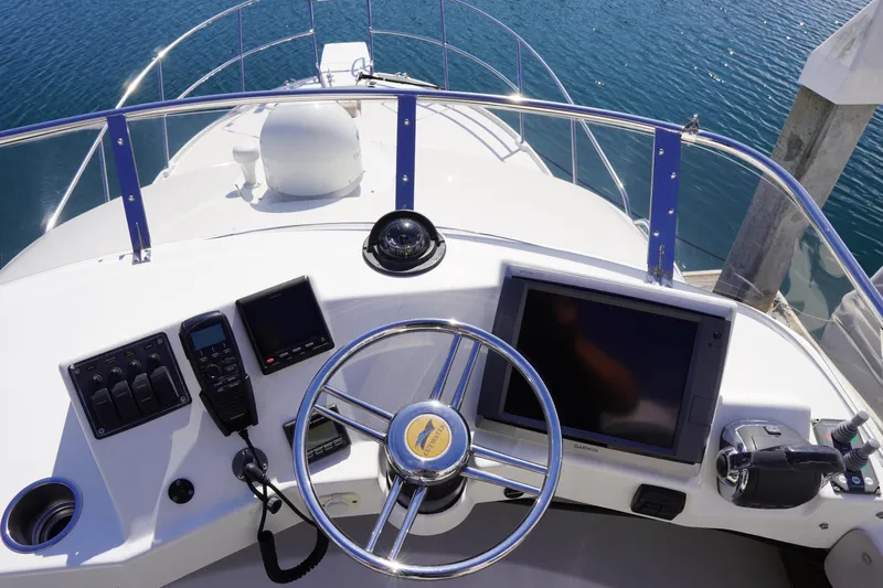 E Ticket Yacht Photos Pics Helm of 2015 Cutwater 30 Command Bridge with navigation equipment and steering wheel.