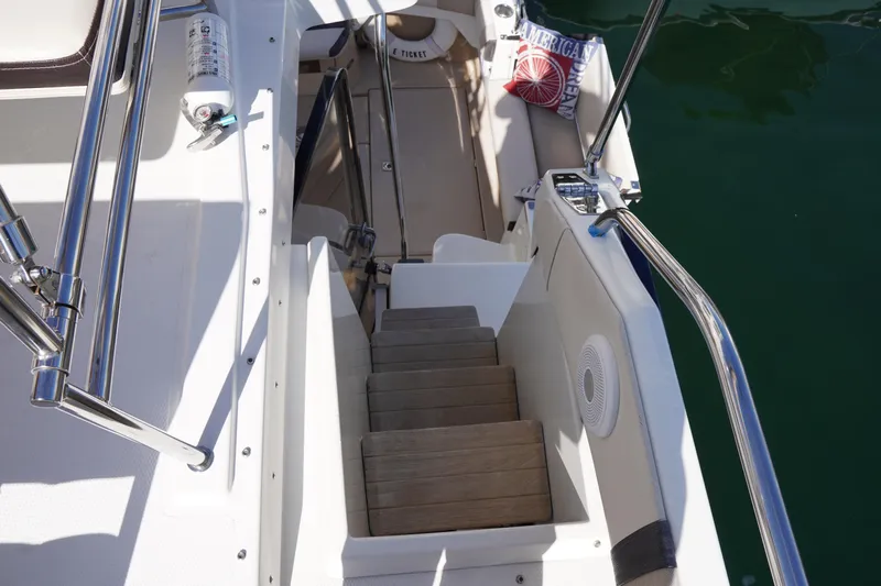 E Ticket Yacht Photos Pics Staircase on 2015 Cutwater 30 Command Bridge yacht, featuring sleek design and safety railings.