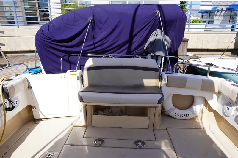 E Ticket Yacht Photos Pics 2015 Cutwater 30 Command Bridge boat interior with seating and life preserver.