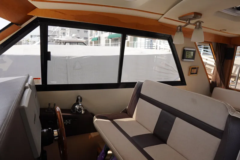 E Ticket Yacht Photos Pics Interior of 2015 Cutwater 30 Command Bridge with helm and seating area.