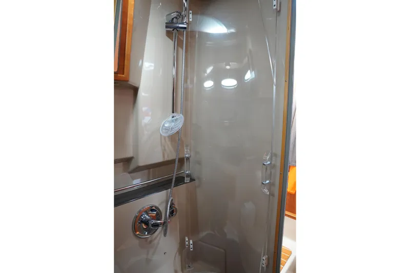 E Ticket Yacht Photos Pics Shower area in 2015 Cutwater 30 Command Bridge boat, featuring modern fixtures.