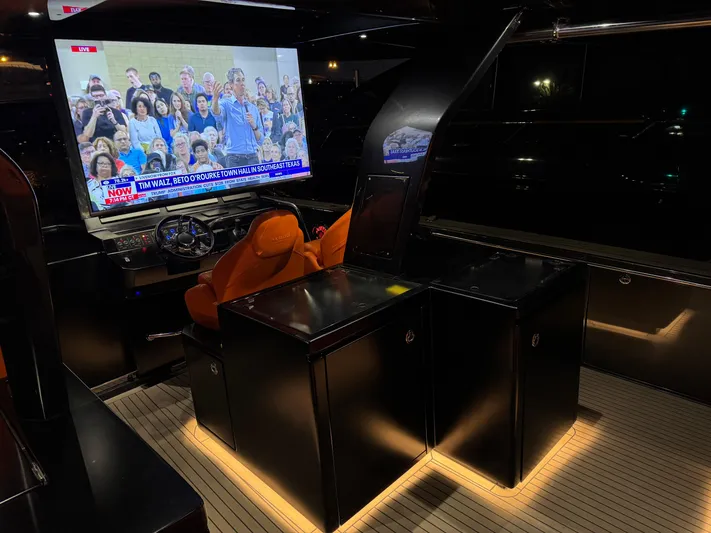 La Doña Yacht Photos Pics Luxurious interior of 2023 Pardo Yachts 50 with illuminated seating and large screen display.